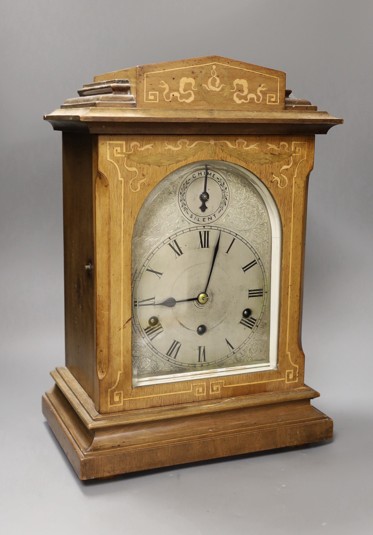 An early 20th century German inlaid mahogany striking and chiming eight day bracket clock, 42cm tall